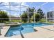 Inviting pool and spa area with lush landscaping at 1638 Moon Valley Dr, Davenport, FL 33896