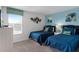 Bedroom with two twin beds and blue bedding at 1638 Moon Valley Dr, Davenport, FL 33896