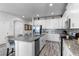 Modern kitchen with granite countertops and stainless steel appliances at 1638 Moon Valley Dr, Davenport, FL 33896
