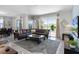 Spacious living room featuring a large sectional sofa, a coffee table, and a large TV at 1638 Moon Valley Dr, Davenport, FL 33896