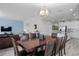 Open concept dining room with a large table, and kitchen views at 1638 Moon Valley Dr, Davenport, FL 33896