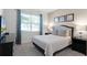 Comfortable bedroom with a queen-size bed and plenty of natural light at 1638 Moon Valley Dr, Davenport, FL 33896