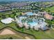Large community pool with waterslide and multiple lounging areas at 1638 Moon Valley Dr, Davenport, FL 33896