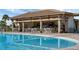 Relaxing pool bar with seating and tropical atmosphere at 1638 Moon Valley Dr, Davenport, FL 33896