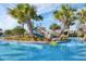 Lazy river with a waterslide and lush landscaping at 1638 Moon Valley Dr, Davenport, FL 33896