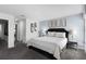 King-size bed, ensuite bathroom access, and calming decor at 1638 Moon Valley Dr, Davenport, FL 33896
