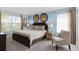Main bedroom with king-size bed and sitting chair at 1638 Moon Valley Dr, Davenport, FL 33896