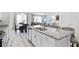 Open kitchen with granite island, stainless steel appliances, and breakfast bar at 1638 Moon Valley Dr, Davenport, FL 33896