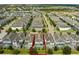 Aerial view of a large neighborhood with many houses and pools at 1638 Moon Valley Dr, Davenport, FL 33896