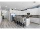 Spacious kitchen with island, stainless steel appliances, and granite countertops at 1638 Moon Valley Dr, Davenport, FL 33896