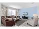 Relaxing living area with comfortable seating, large TV, and plenty of natural light at 1638 Moon Valley Dr, Davenport, FL 33896
