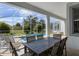 Outdoor patio with table and chairs, overlooking the pool at 1638 Moon Valley Dr, Davenport, FL 33896