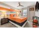 Basketball themed bedroom with a king-size bed and a wall-mounted TV at 2163 Copper Bell Pl, Kissimmee, FL 34747