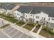 Modern townhouses with two-car garages and lush landscaping at 2163 Copper Bell Pl, Kissimmee, FL 34747