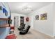 Game room with two comfortable gaming chairs and wall-mounted shelves at 2163 Copper Bell Pl, Kissimmee, FL 34747