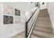 Modern staircase with dark wood handrail and neutral carpet at 2163 Copper Bell Pl, Kissimmee, FL 34747