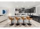 Modern kitchen with stainless steel appliances and an island with seating at 2163 Copper Bell Pl, Kissimmee, FL 34747