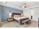 Main bedroom with a king-size bed, and plenty of natural light at 2163 Copper Bell Pl, Kissimmee, FL 34747