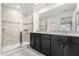 Double vanity bathroom with a large walk-in shower at 2163 Copper Bell Pl, Kissimmee, FL 34747
