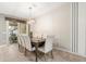 Elegant dining room with large wooden table and statement wallpaper at 2163 Copper Bell Pl, Kissimmee, FL 34747