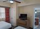 Bedroom with two double beds, TV, and a dresser at 12527 Floridays Resort Dr # 510E, Orlando, FL 32821