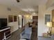 Open living room with view of kitchen and dining area, featuring comfortable seating at 12527 Floridays Resort Dr # 510E, Orlando, FL 32821