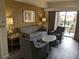 Comfortable living room with sofa and armchairs, featuring a view to balcony at 12527 Floridays Resort Dr # 510E, Orlando, FL 32821