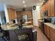 Open kitchen with granite counters, stainless steel appliances, and island at 3635 Daydream Pl, Saint Cloud, FL 34772