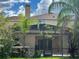 Home's backyard with a screened patio at 3635 Daydream Pl, Saint Cloud, FL 34772