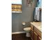 Small bathroom with toilet and wooden vanity at 3635 Daydream Pl, Saint Cloud, FL 34772
