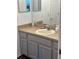 Bathroom vanity with sink and gray cabinets at 3635 Daydream Pl, Saint Cloud, FL 34772
