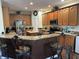 Kitchen boasts granite countertops, stainless steel appliances, and island at 3635 Daydream Pl, Saint Cloud, FL 34772