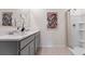 Modern bathroom with gray vanity, double sinks, and shower at 4093 Giorgio Dr, Winter Haven, FL 33884