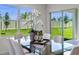 Dining area with glass top table and sliding doors leading to backyard at 4093 Giorgio Dr, Winter Haven, FL 33884