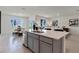 Open kitchen features a large island with seating and white countertops at 4093 Giorgio Dr, Winter Haven, FL 33884