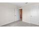 Bright bedroom with carpet flooring, two closets and access to a bathroom at 4093 Giorgio Dr, Winter Haven, FL 33884