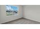 Bedroom with a view of the neighborhood and carpet flooring at 4093 Giorgio Dr, Winter Haven, FL 33884