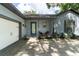 House exterior with a white garage door and blue front door at 5525 Barma St, Orlando, FL 32807