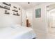 Comfortable bedroom with a double bed and access to a walk-in closet at 5525 Barma St, Orlando, FL 32807