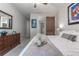 Spacious main bedroom with a dresser, and a sliding barn door at 5525 Barma St, Orlando, FL 32807
