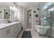 Elegant bathroom with double vanity, soaking tub, and glass shower at 5525 Barma St, Orlando, FL 32807