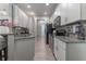 Modern kitchen with stainless steel appliances and granite countertops at 5525 Barma St, Orlando, FL 32807