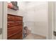 Walk-in closet with wire shelving and dresser at 5525 Barma St, Orlando, FL 32807