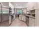 Modern kitchen with stainless steel appliances and granite countertops at 5525 Barma St, Orlando, FL 32807