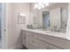 Modern bathroom featuring a double vanity with marble countertop at 5525 Barma St, Orlando, FL 32807