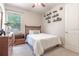 Cozy bedroom with a double bed and built-in shelving at 5525 Barma St, Orlando, FL 32807