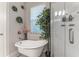 Bathroom with freestanding tub, shower, and window at 5525 Barma St, Orlando, FL 32807