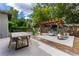 Backyard with pergola, fire pit, and patio furniture at 5525 Barma St, Orlando, FL 32807
