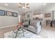 Bright living room with gray couch, coffee table, and open floor plan at 5525 Barma St, Orlando, FL 32807