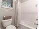 Bright bathroom with a shower/tub combo and white subway tile at 5525 Barma St, Orlando, FL 32807